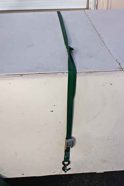 IMG_8504_800w.jpg - The top is held down by four straps with adjusters.